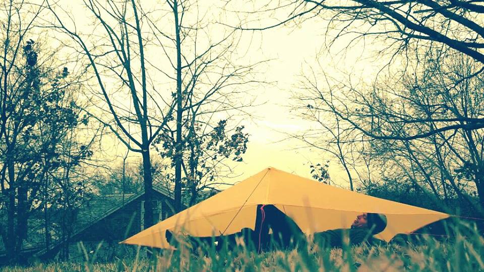 This photo is an example of an open tarp. In inclement conditions one or more sides can be directly staked to the ground to provide more protection in a storm.